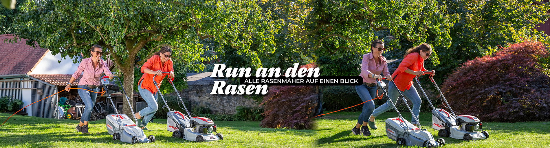 Zwei Frauen rennen mit Rasenmäher um die Wette